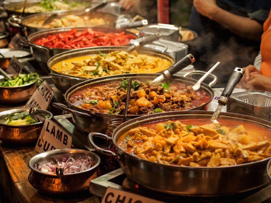 A selection of trending foods and cuisines from in London ready to serve in pans and dishes