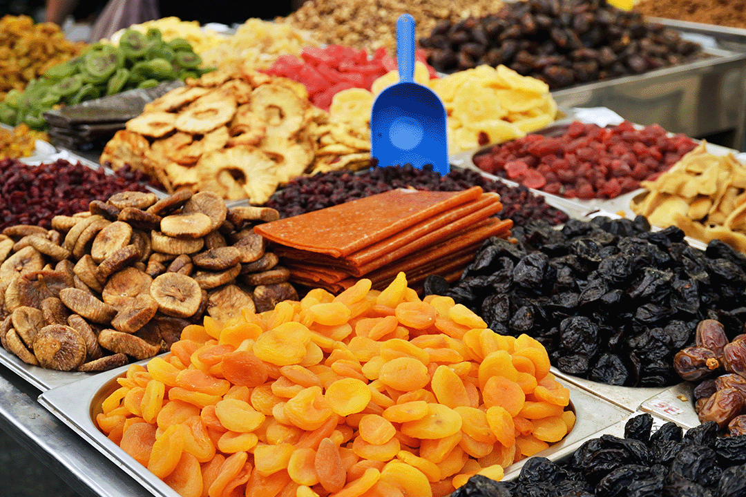 A selection of wholesale dried fruits including apricots, prunes and banana slices